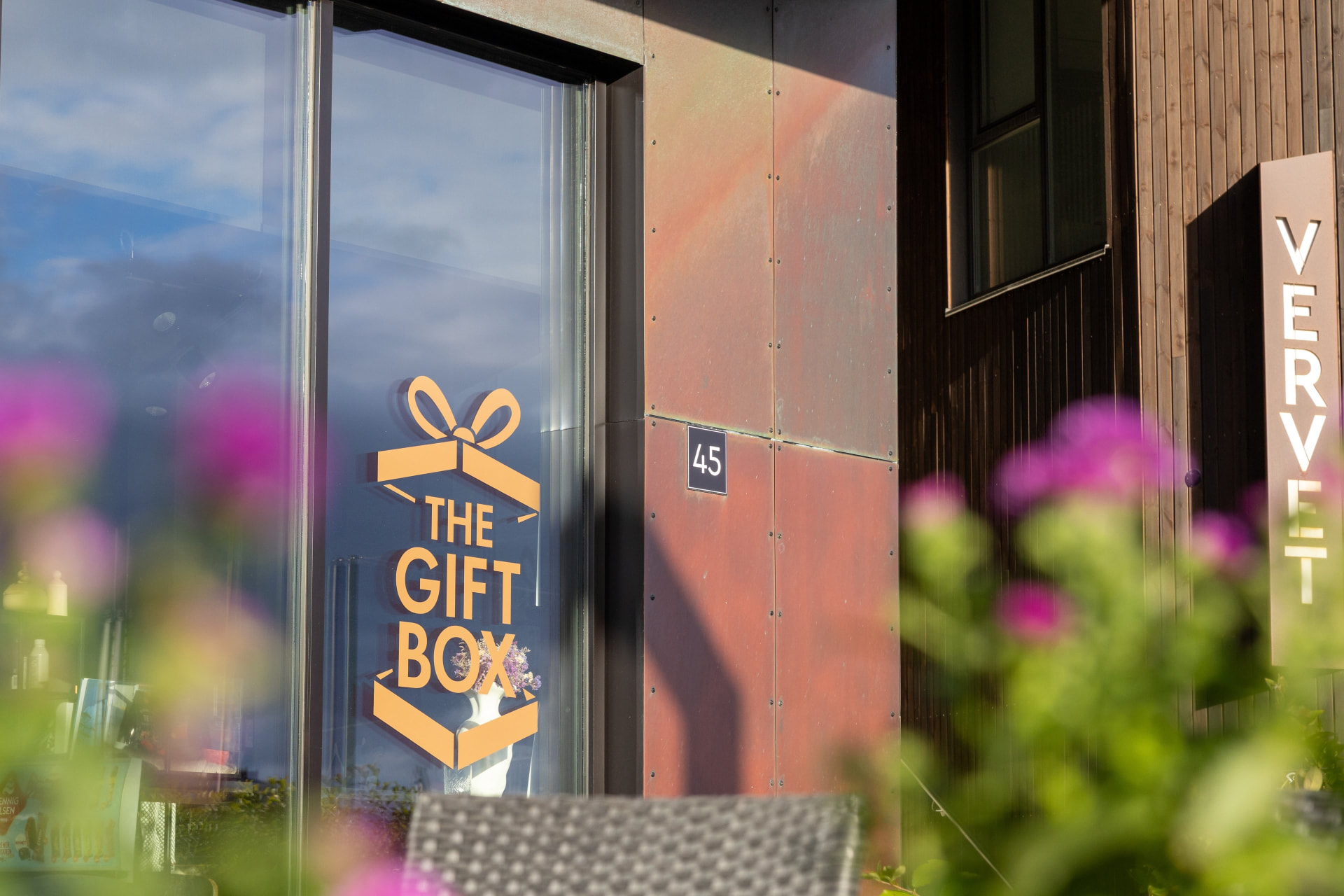 The entrance to The Gift Box at Vervet with flowers in the foreground